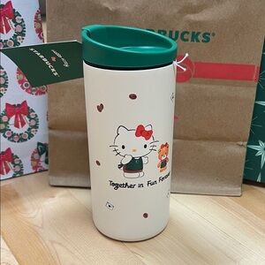 Starbucks Cream Tumbler with Green Lid and Hello Kitty Design